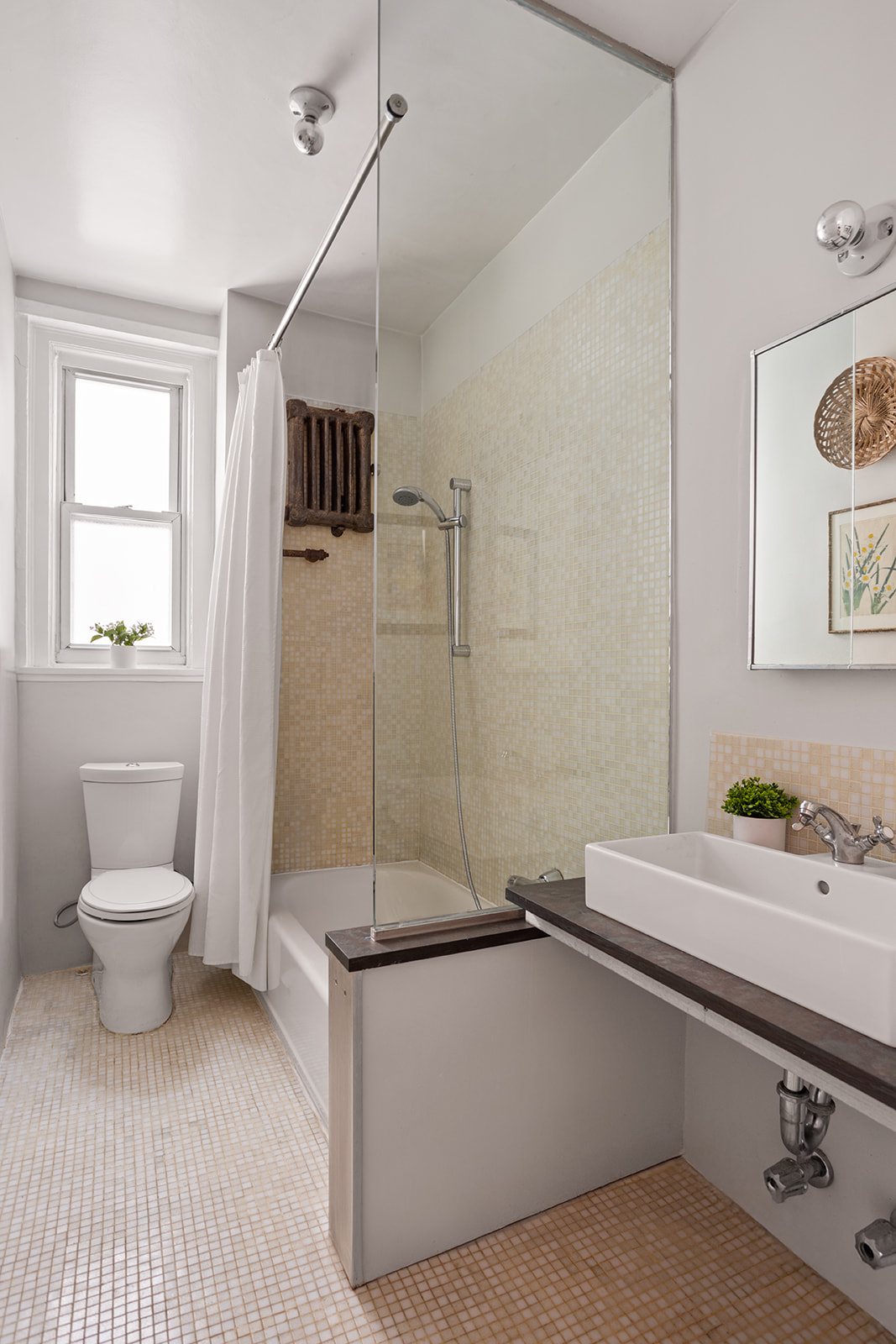 34-43 82nd Street, Unit 22 Queens, NY 11372 - Photo 7 of 11 a bathroom with a sink a toilet and shower