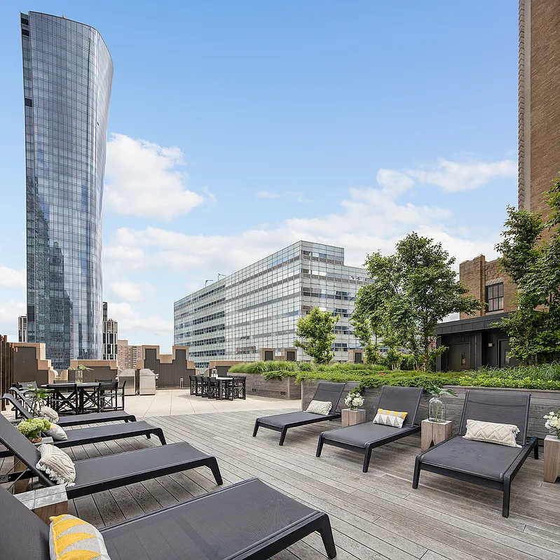100 Barclay Street, Unit 21AD Manhattan, NY 10007 - Photo 25 of 37 a view of a patio with couches chairs and a potted plant
