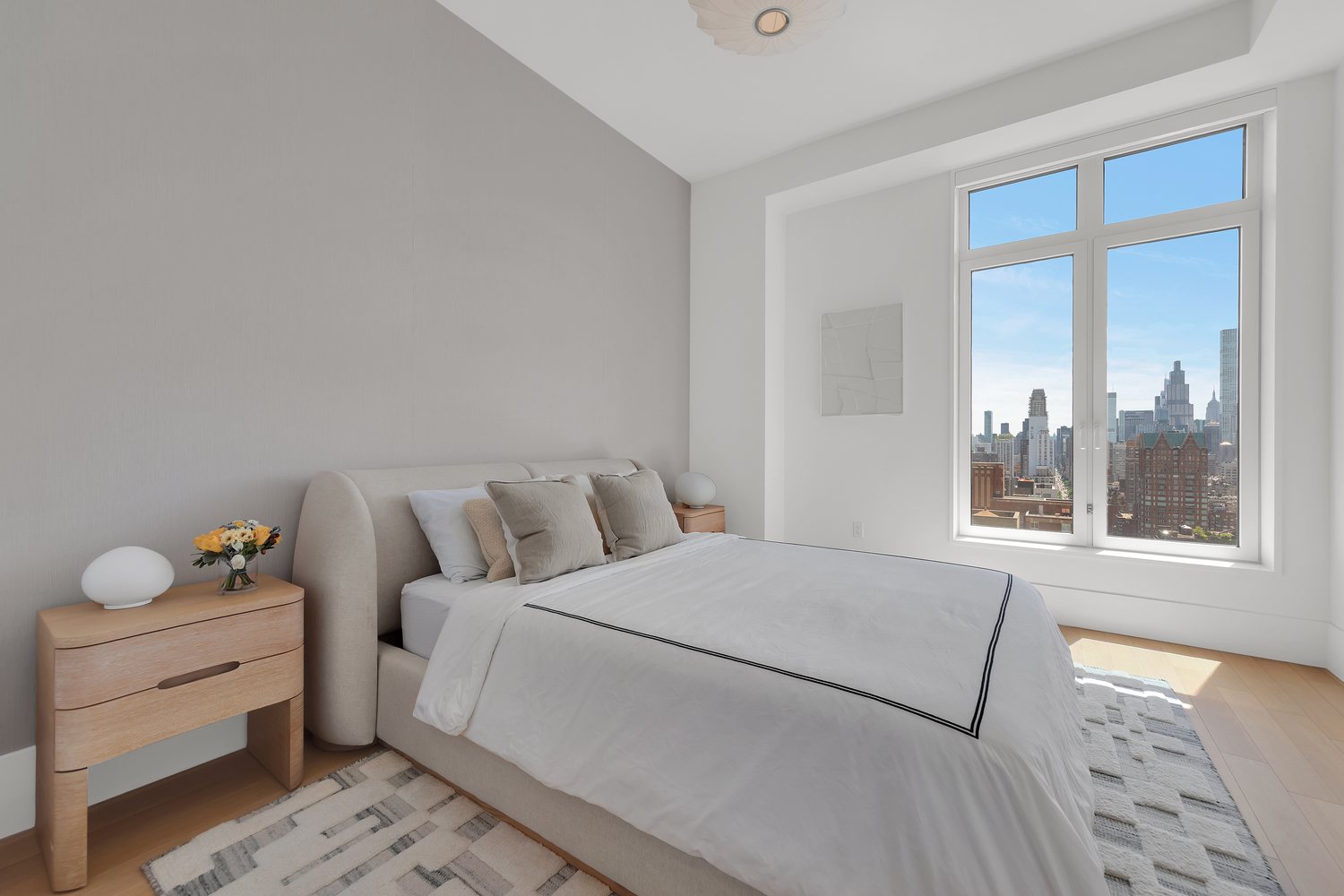 200 East 83rd Street, Unit 29B Manhattan, NY 10028 - Photo 7 of 20 a bed room with a bed and a window