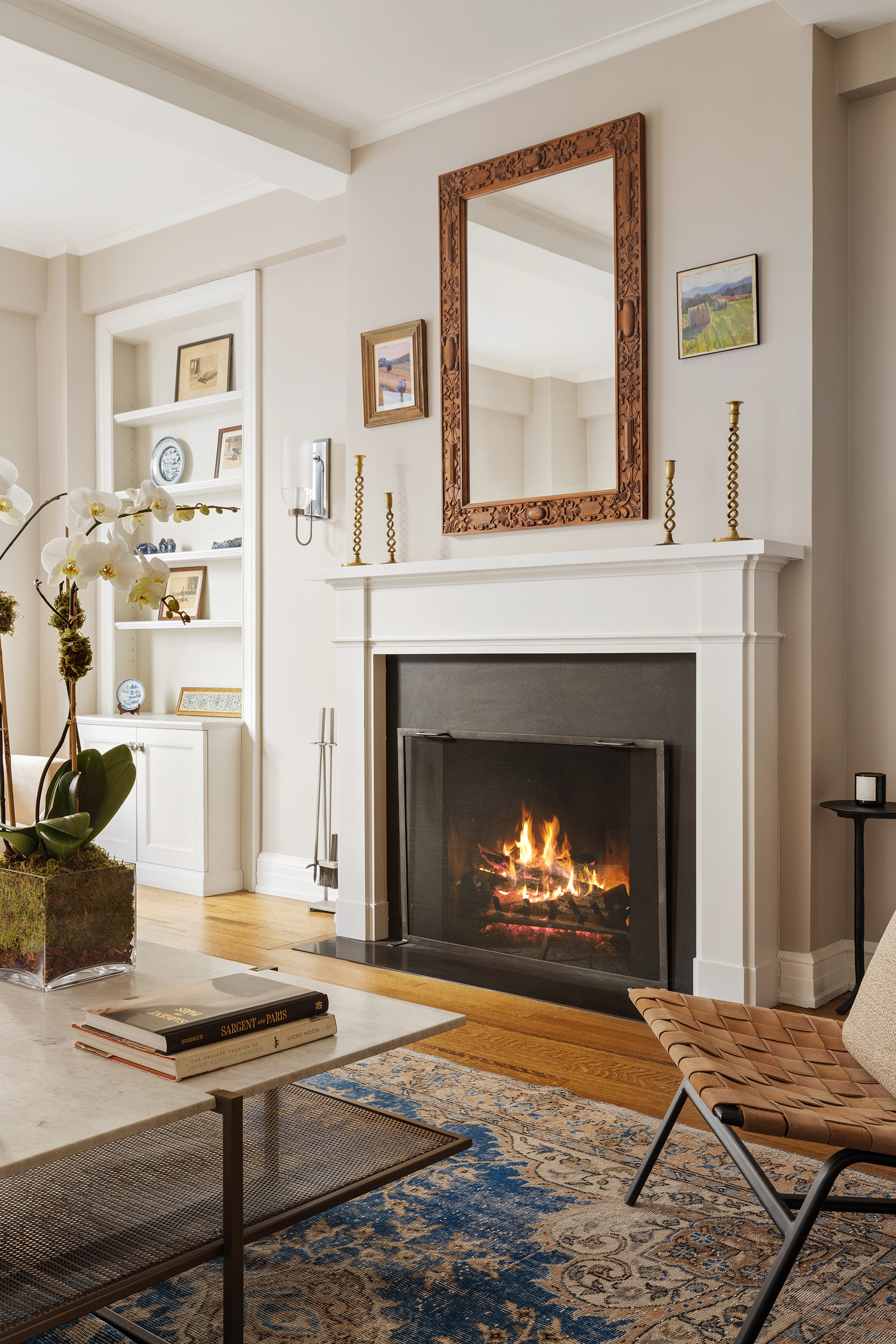 125 East 74th Street, Unit 5B Manhattan, NY 10021 - Photo 5 of 13 a living room with furniture and a fireplace