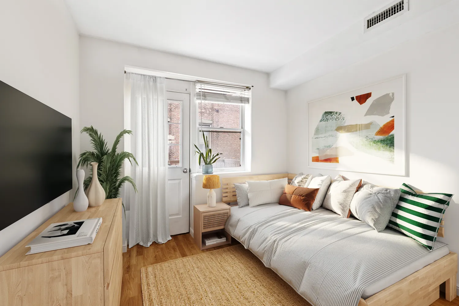 a bedroom with a bed and a flat screen tv