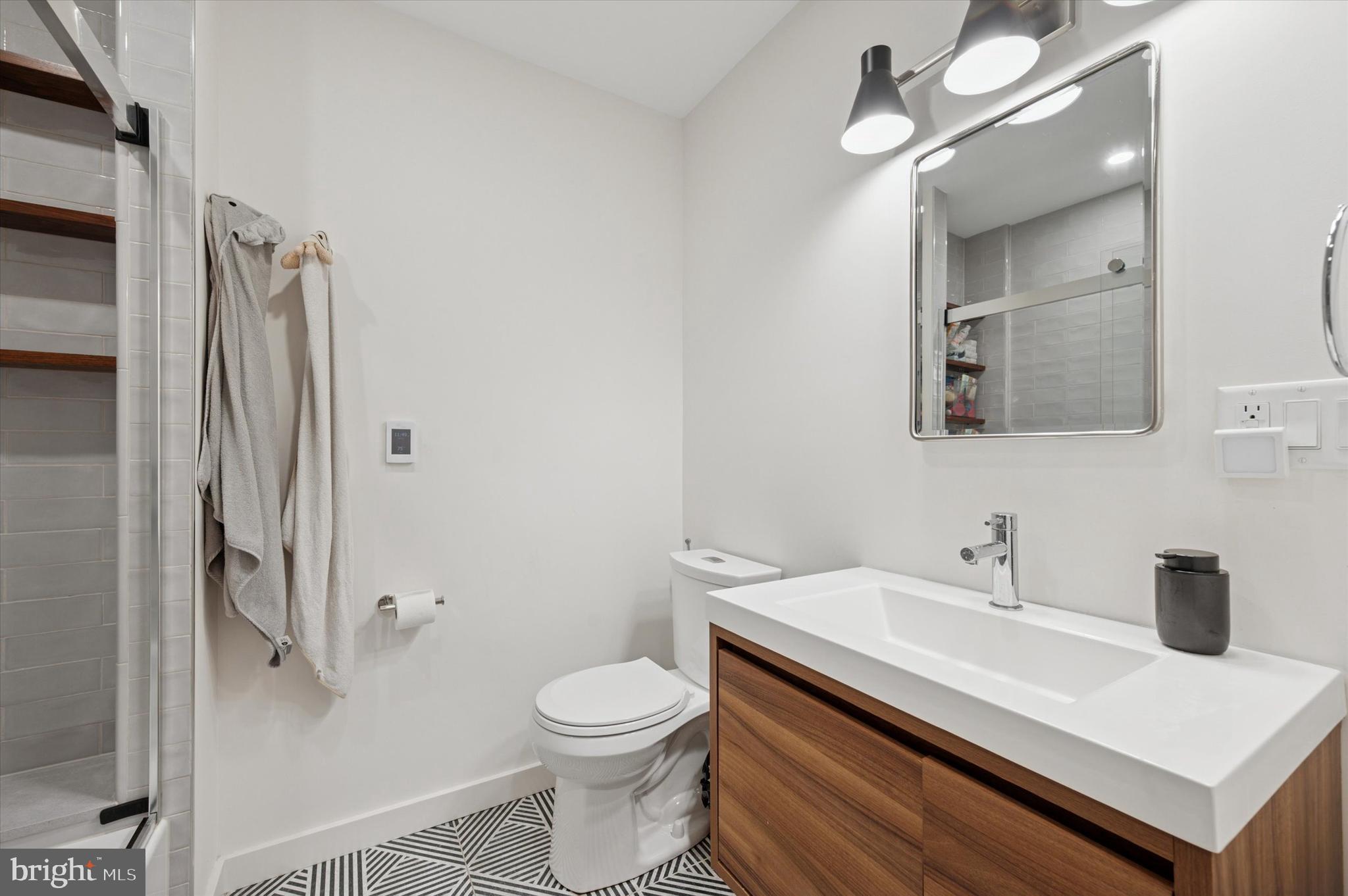 283 Locust Street Philadelphia, PA 19106 - Photo 25 of 33 a bathroom with a sink a toilet and shower