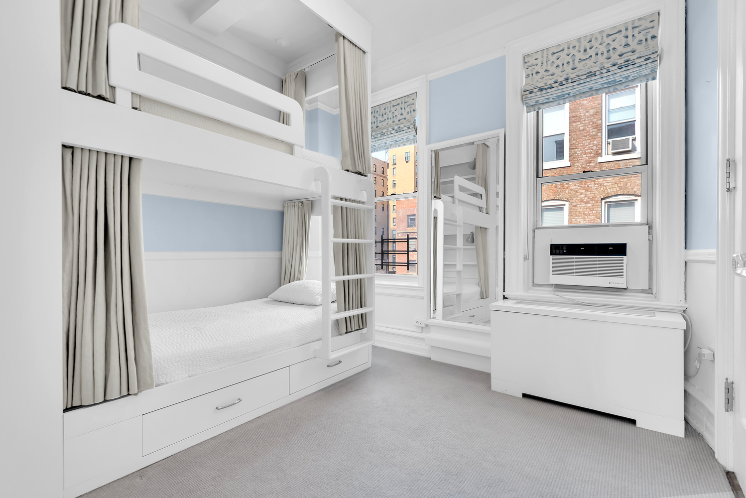 122 East 82nd Street, Unit 8C Manhattan, NY 10028 - Photo 10 of 15 a bedroom with a bed and a window