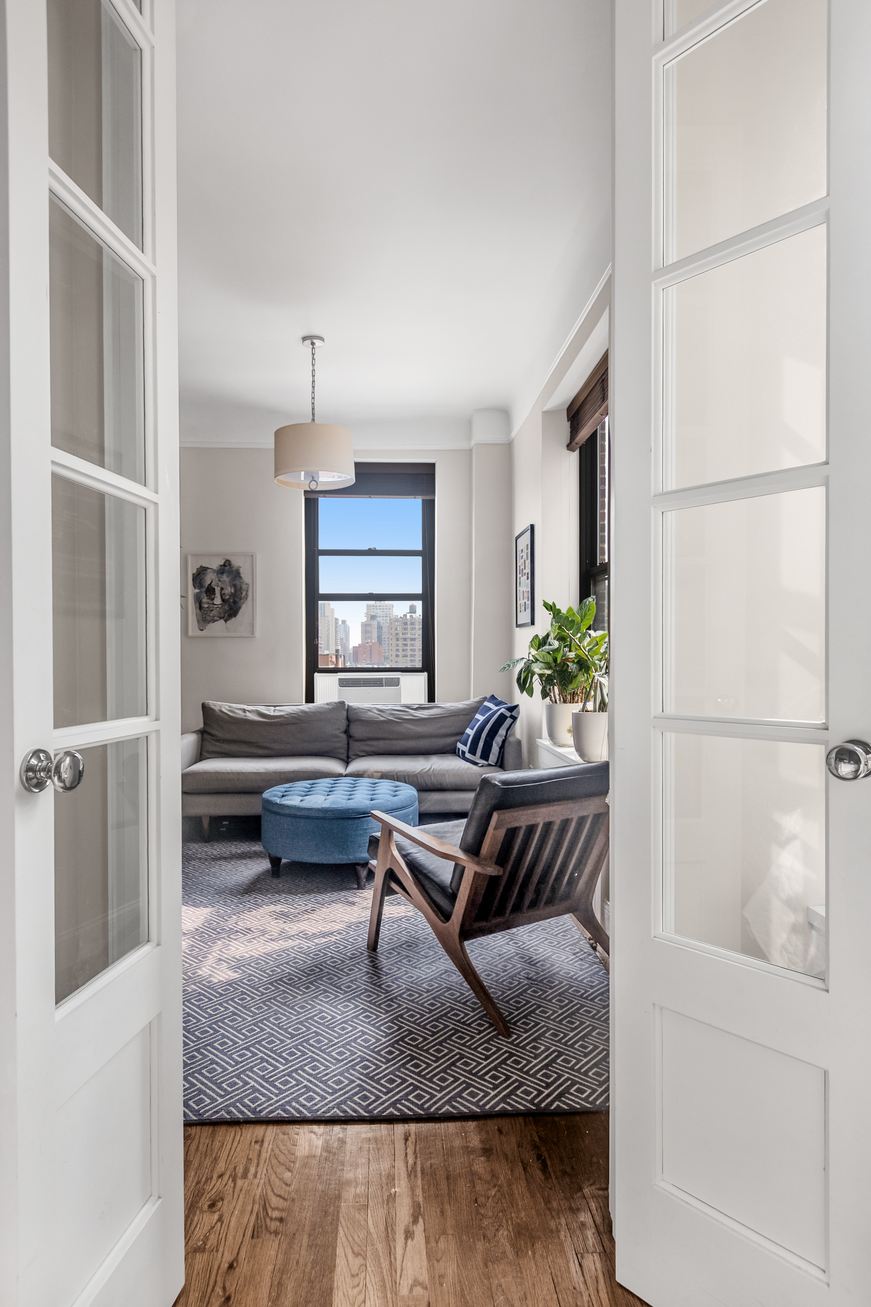 51 West 81st Street, Unit 9D Manhattan, NY 10024 - Photo 6 of 15 a living room with furniture and a table