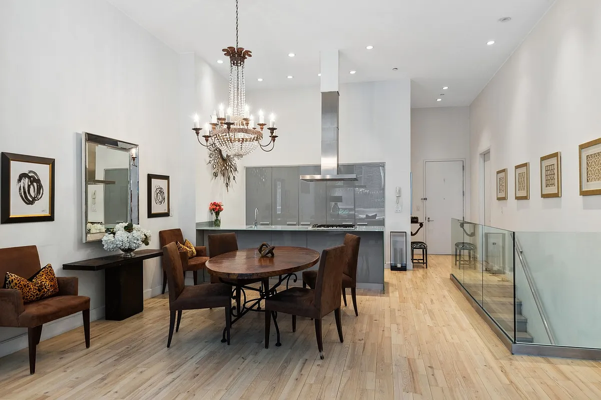 420 West 25th Street, Unit TH1E Manhattan, NY 10001 - Photo 5 of 22 a view of a dining room with furniture and wooden floor