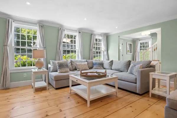 a living room with furniture and windows