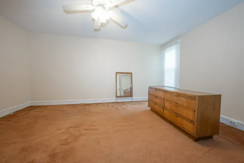 a room with a dresser