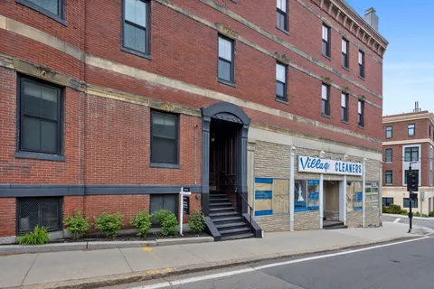 a view of a building with brick walls
