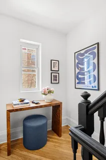 a workspace with furniture and window