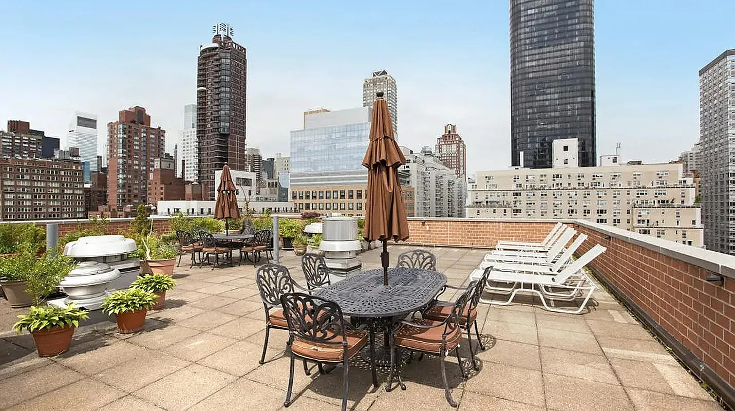 333 East 66th Street, Unit 8C Manhattan, NY 10065 - Photo 12 of 13 a view of outdoor space with a table and chairs