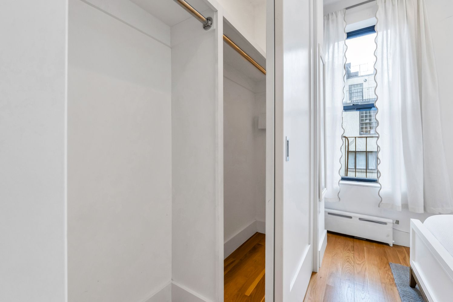 223 West 10th Street, Unit 2C Manhattan, NY 10014 - Photo 5 of 11 a view of bedroom with furniture and wooden floor