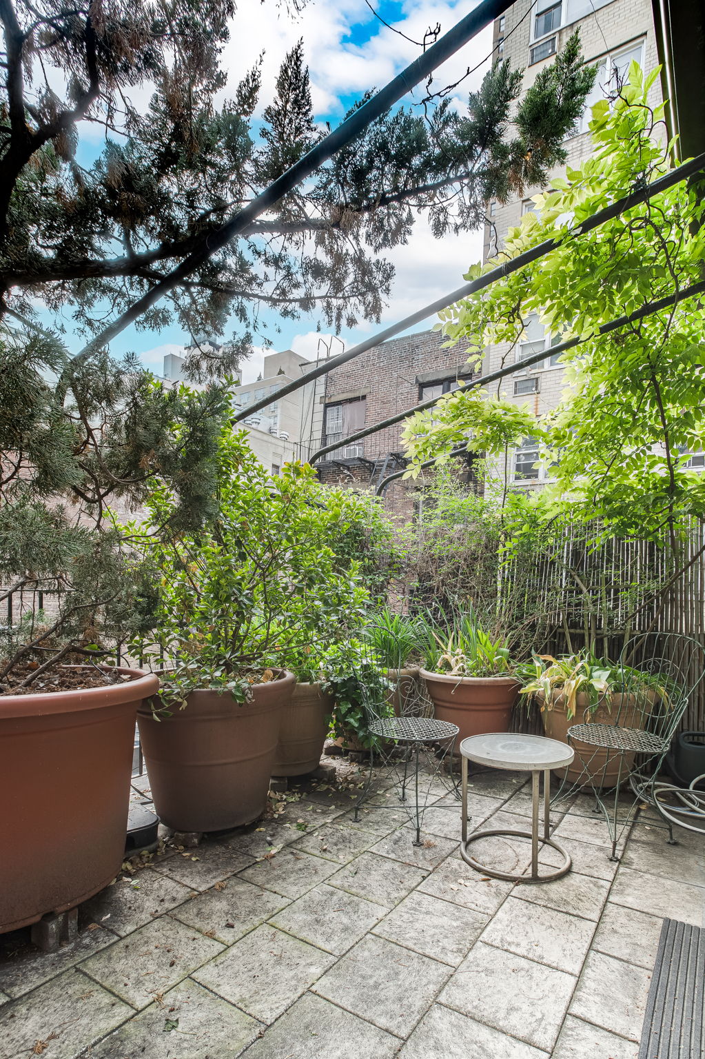 206 East 30th Street Manhattan, NY 10016 - Photo 20 of 21 a view of a sitting area with furniture and plants