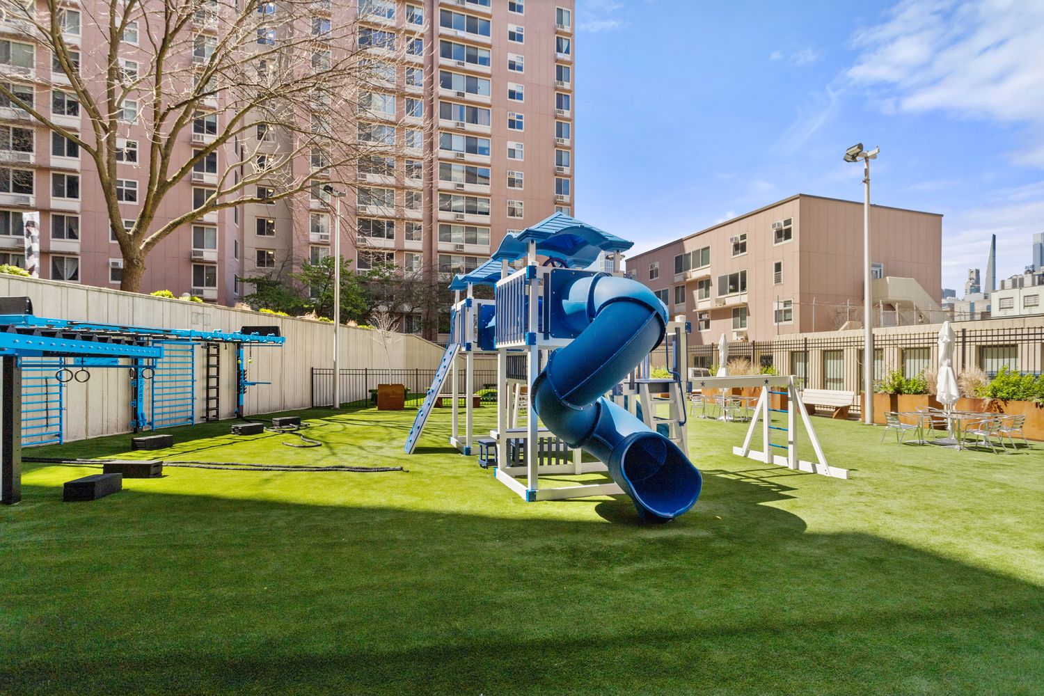 575 Main Street, Unit 509 Manhattan, NY 10044 - Photo 19 of 25 a view of a house with a swimming pool