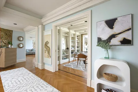 a living room with furniture and a rug