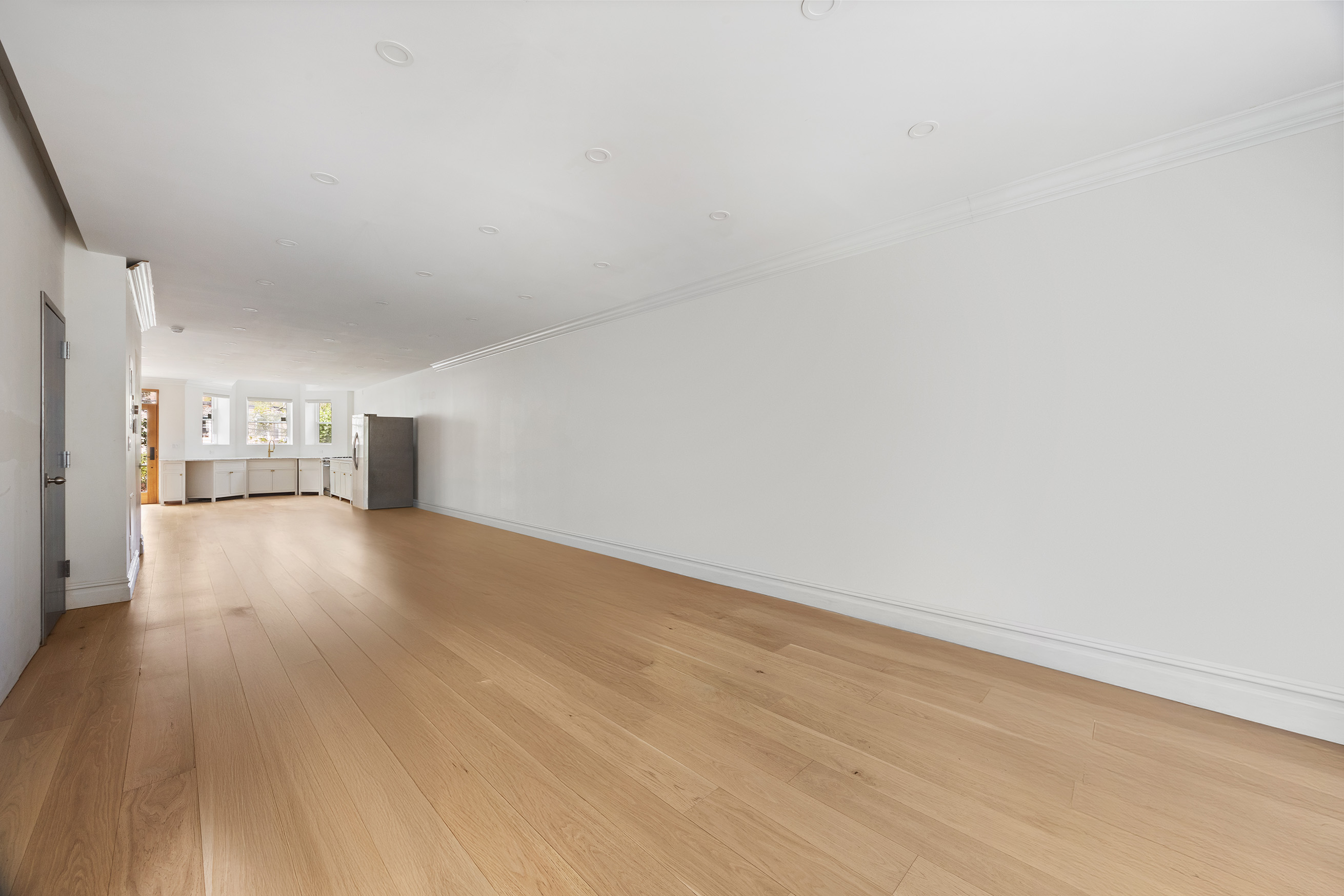 1423 Park Place Brooklyn, NY 11213 - Photo 4 of 17 a view of empty room with wooden floor