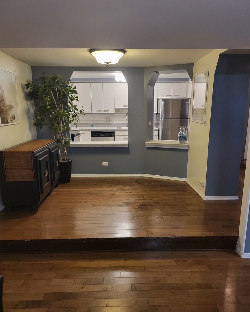 6337 Roosevelt Road, Unit 105 Berwyn, IL 60402 - Photo 4 of 21 a view of kitchen and wooden floor