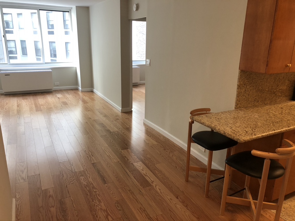 61 West 62nd Street, Unit 7C Manhattan, NY 10023 - Photo 2 of 7 a view of a room with furniture and wooden floor