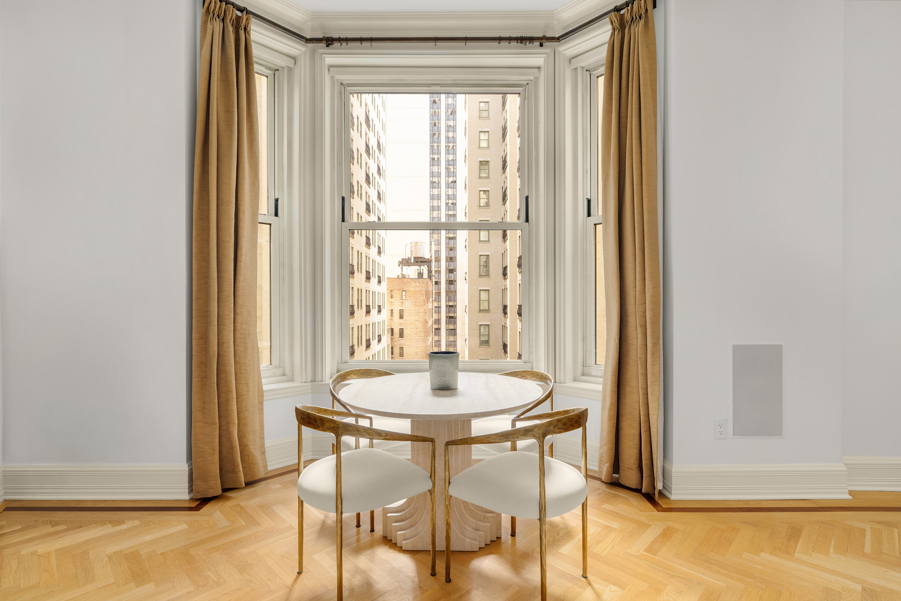 1 Central Park South, Unit 1010 Manhattan, NY 10019 - Photo 1 of 11 a dining room with furniture and window