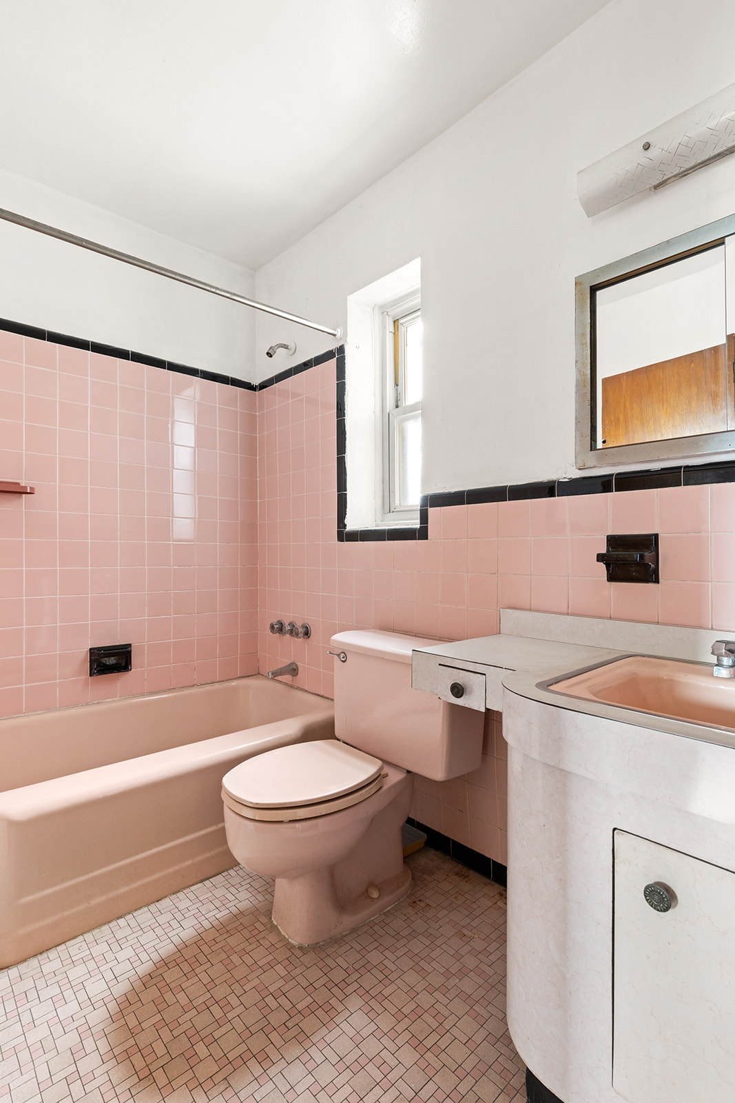 612 17th Street Brooklyn, NY 11218 - Photo 6 of 12 a bathroom with a sink toilet a mirror and shower