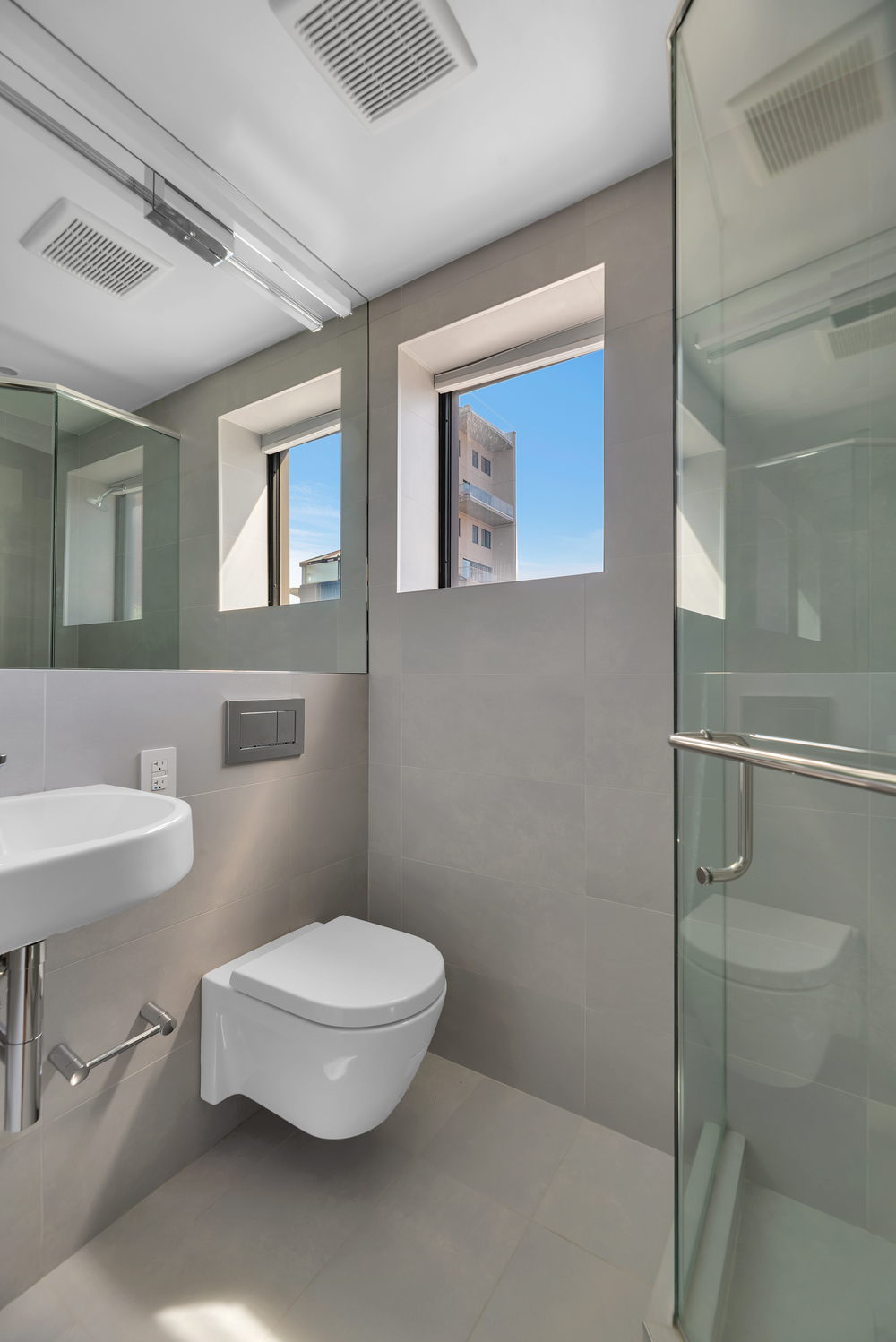 440 West 20th Street Manhattan, NY 10011 - Photo 14 of 35 a bathroom with a toilet a sink and mirror