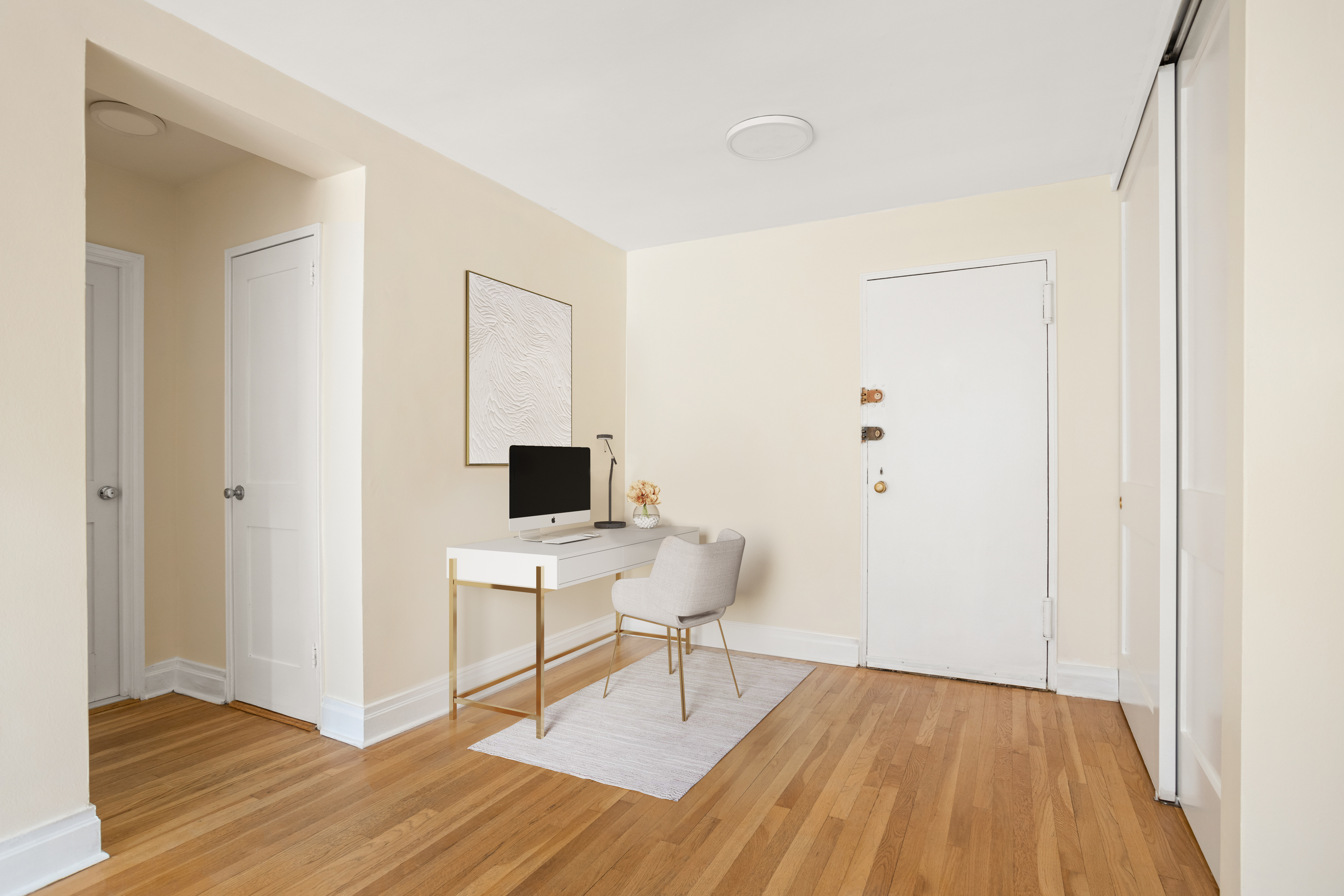 140 7th Avenue, Unit 7M Manhattan, NY 10011 - Photo 3 of 11 a workspace with wooden floor and a window