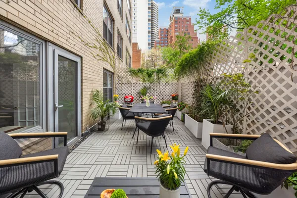 a view of a chairs and table in a patio