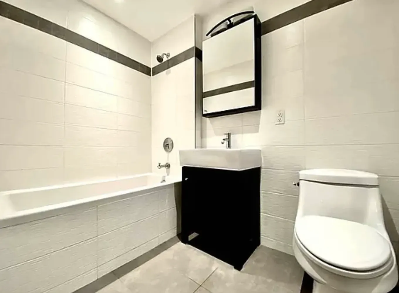 a bathroom with a toilet a sink and bathtub