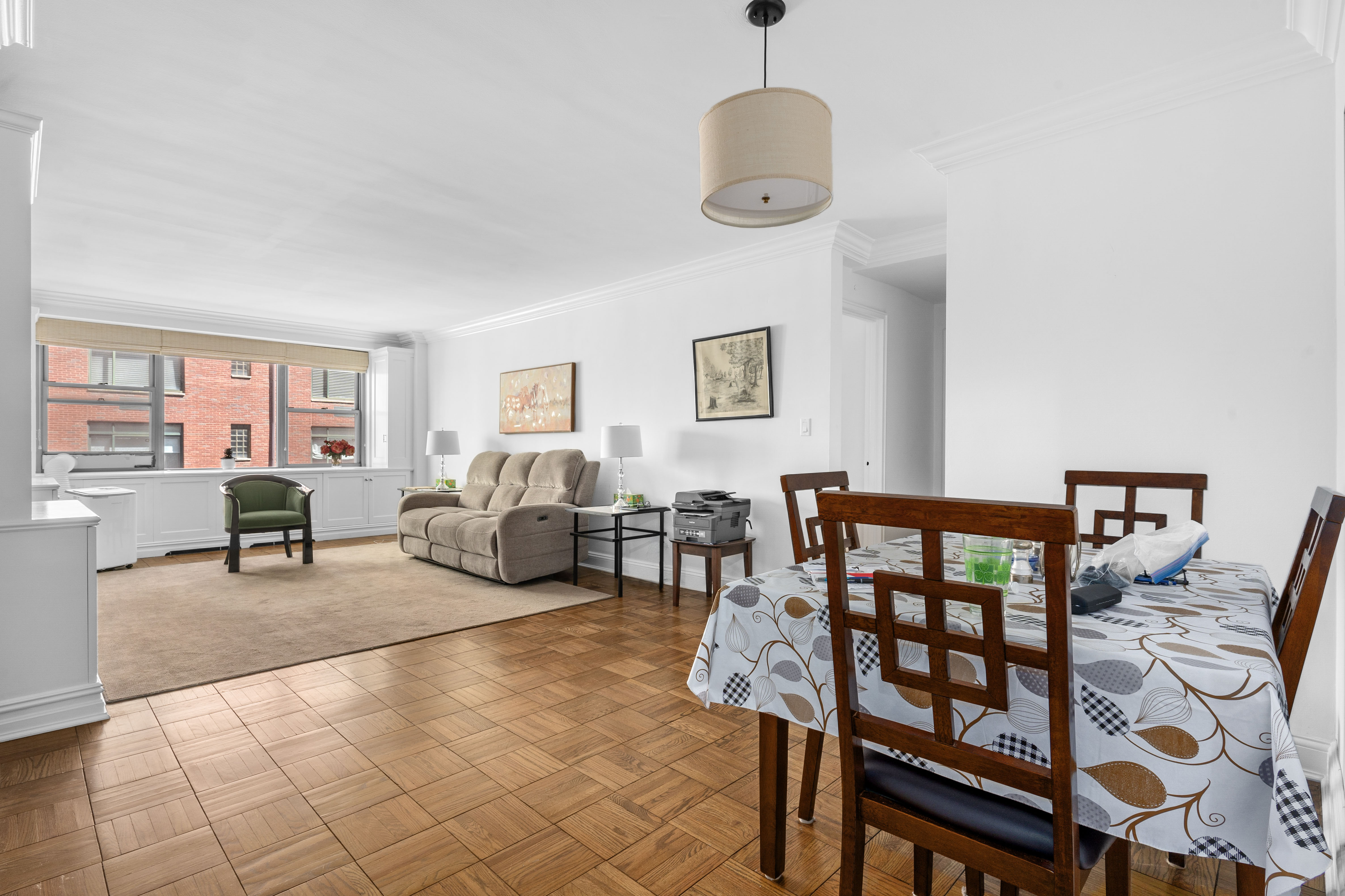 55 East 87th Street, Unit 5M Manhattan, NY 10128 - Photo 2 of 10 a view of a livingroom with furniture and window