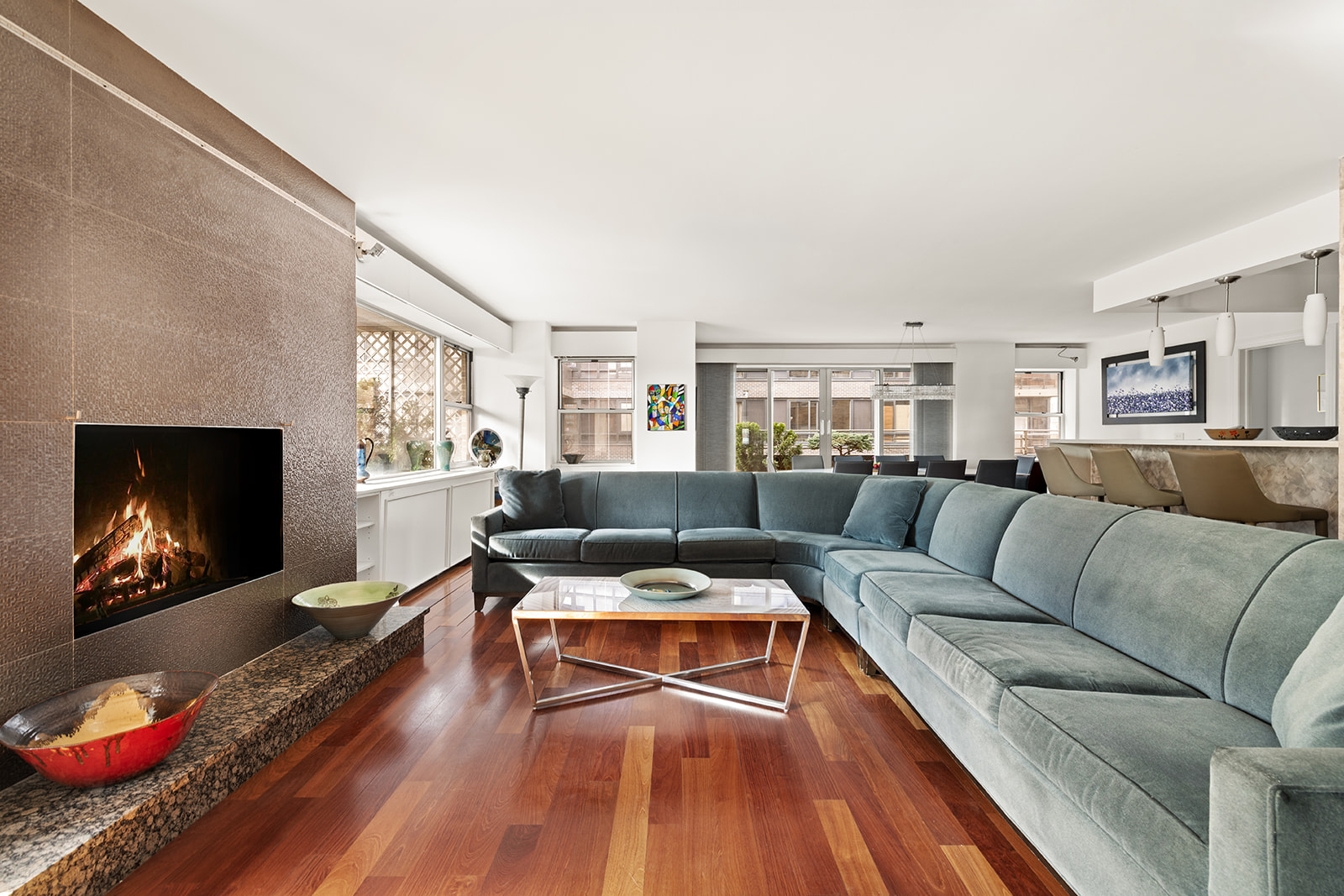 330 East 49th Street, Unit 12E Manhattan, NY 10017 - Photo 2 of 16 a living room with furniture and a fireplace