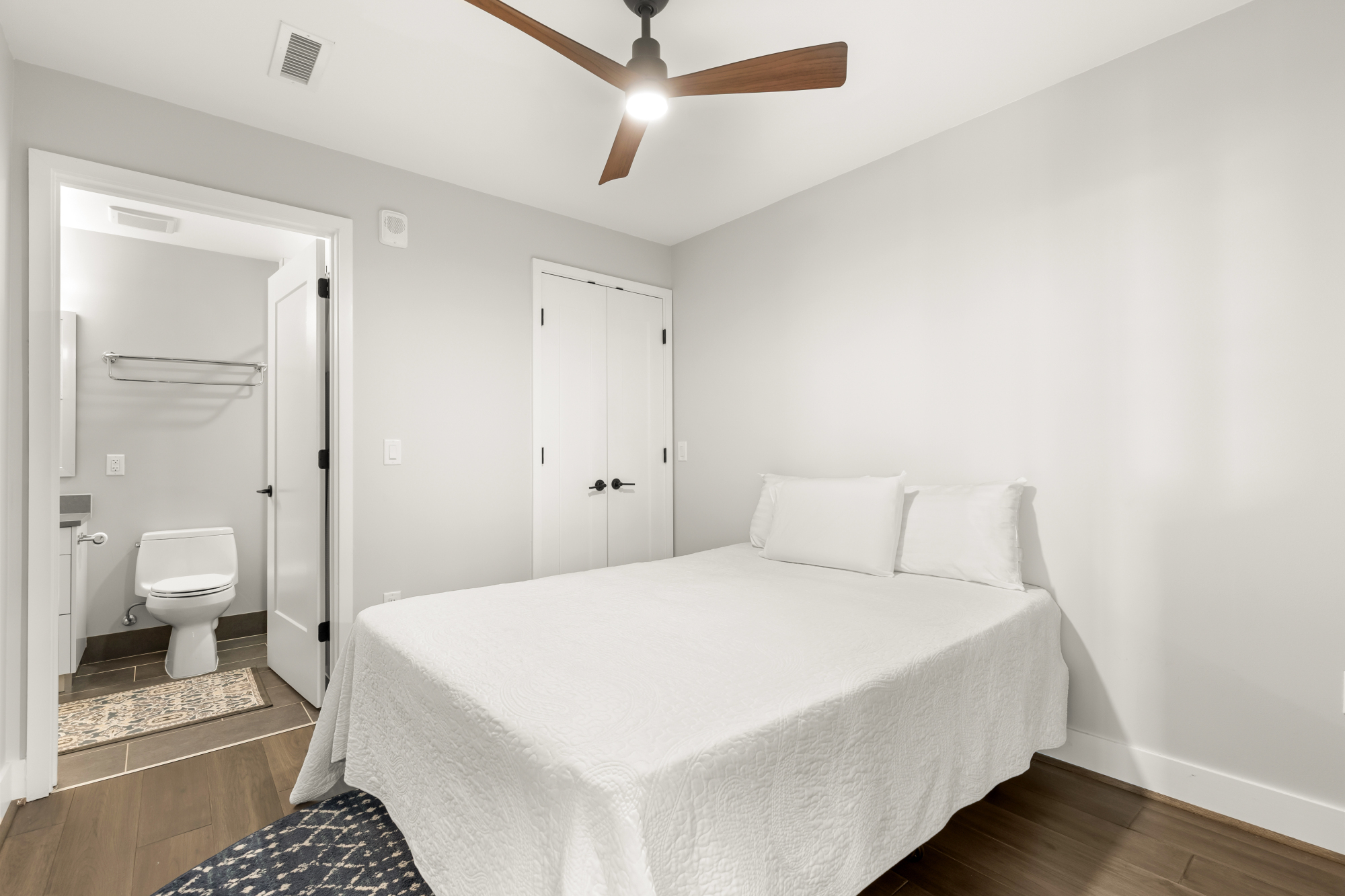 1300 4th Street Southeast, Unit PH02 Washington, DC 20003 - Photo 23 of 38 a bedroom with a bed and a view of bathroom