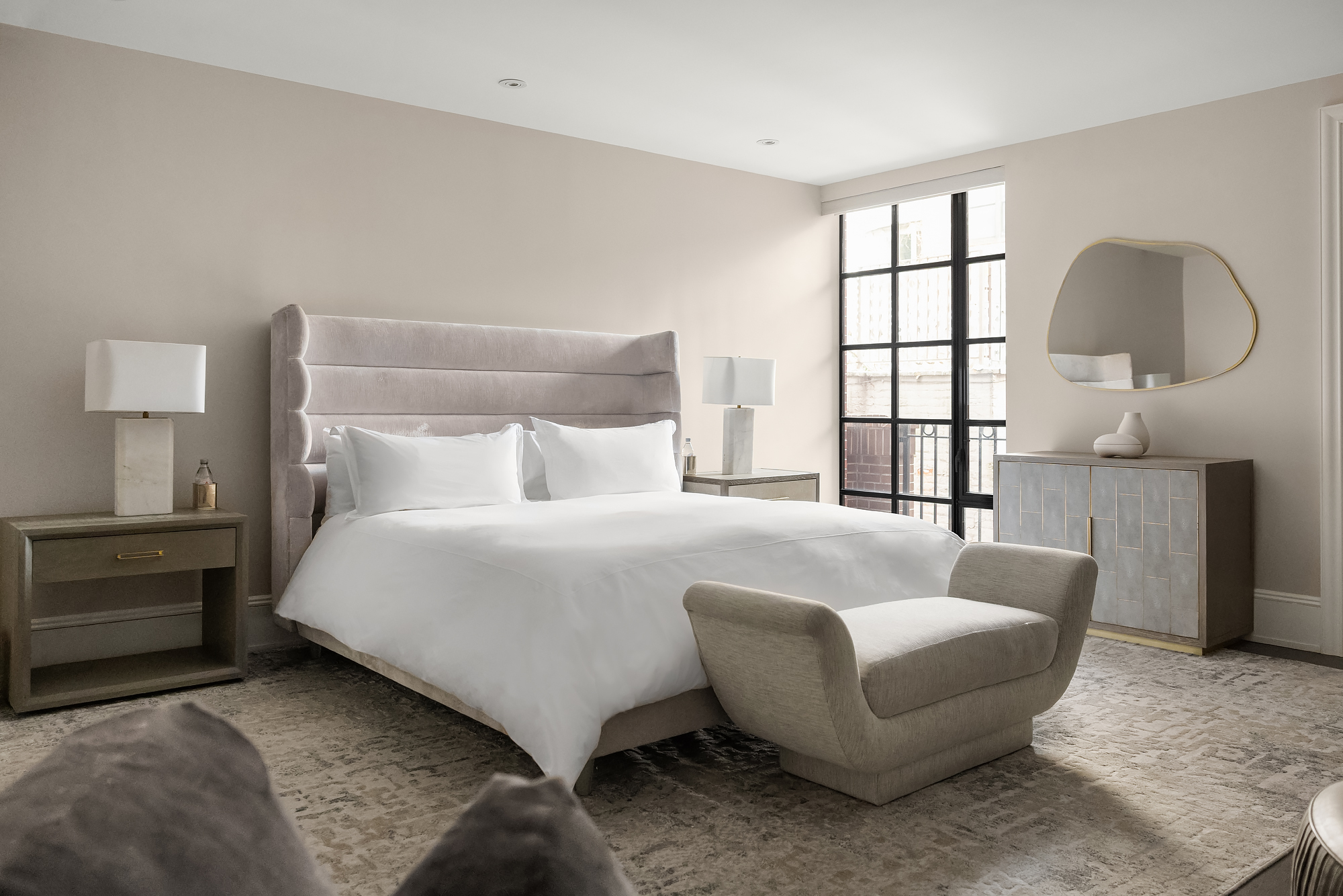 123 East 61st Street Manhattan, NY 10065 - Photo 12 of 31 a bedroom with bed and a large window