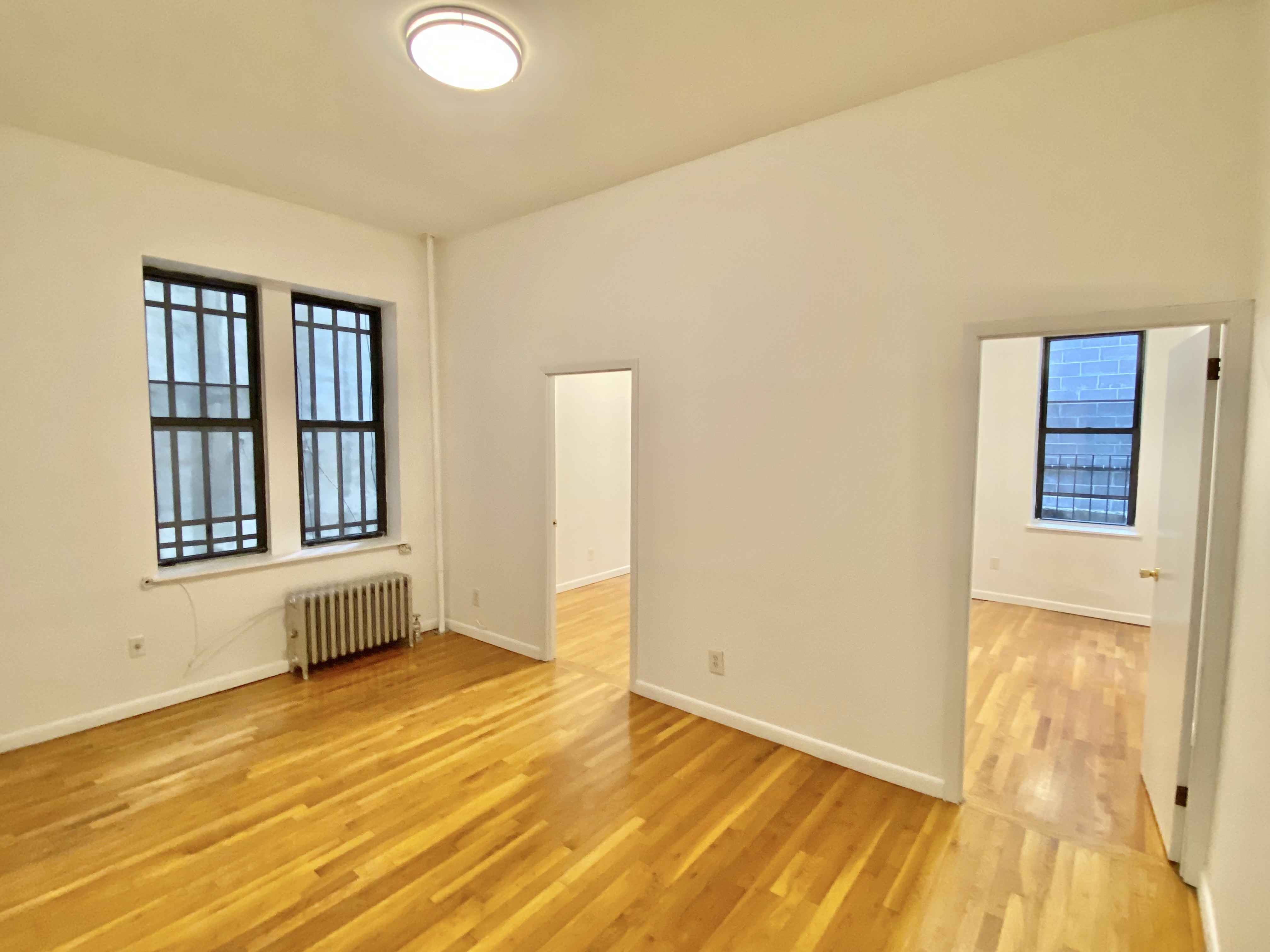 a view of an empty room with glass door