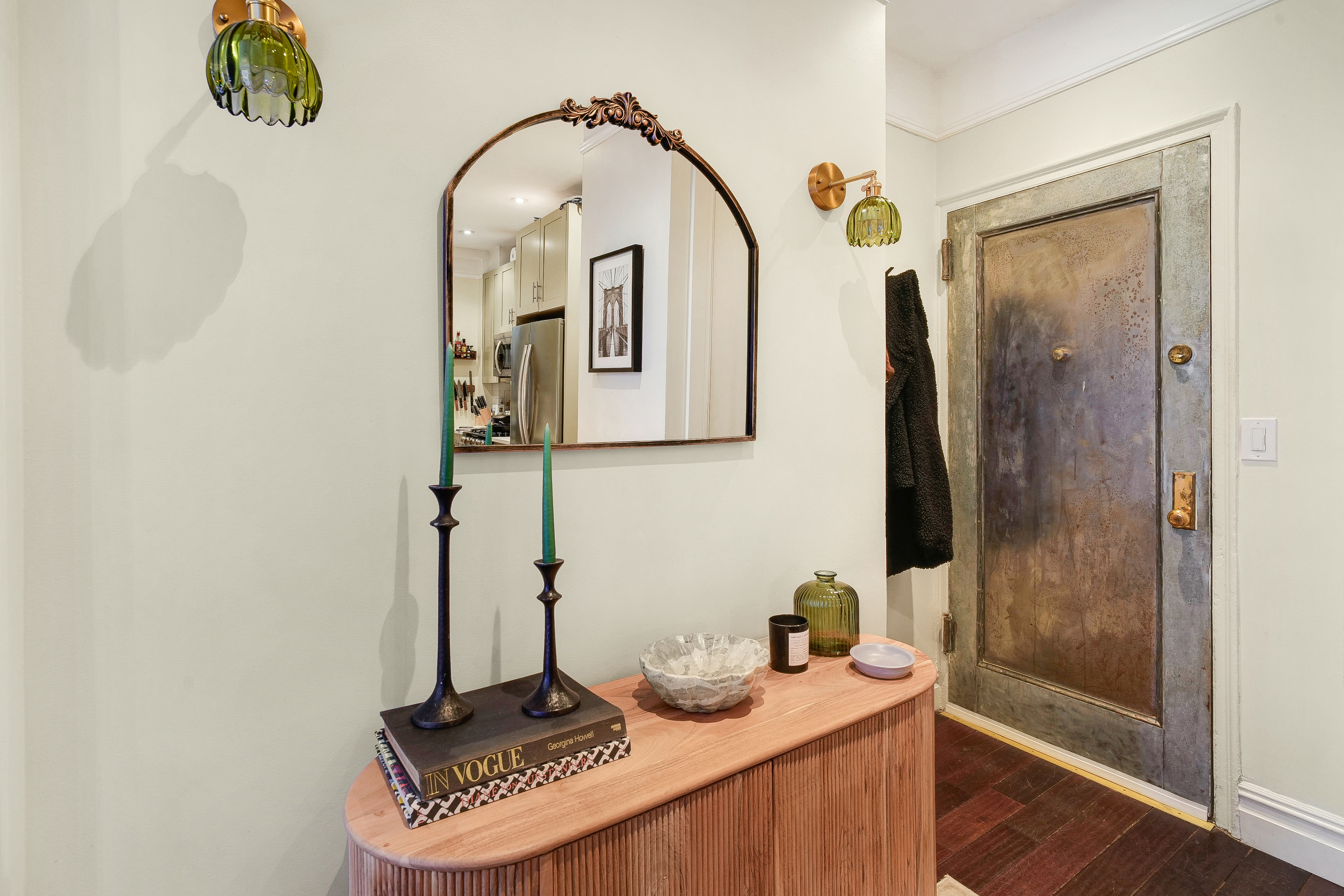 114 West 70th Street Manhattan, NY 10023 - Photo 6 of 9 a bathroom with a sink a mirror and shower