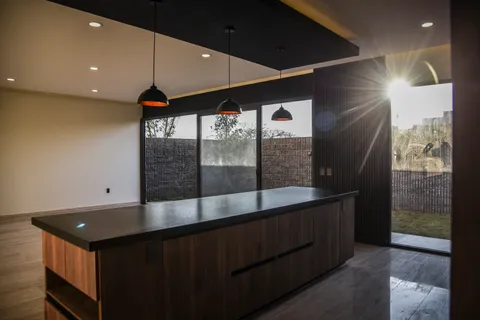 a kitchen with stainless steel appliances granite countertop a stove and a microwave