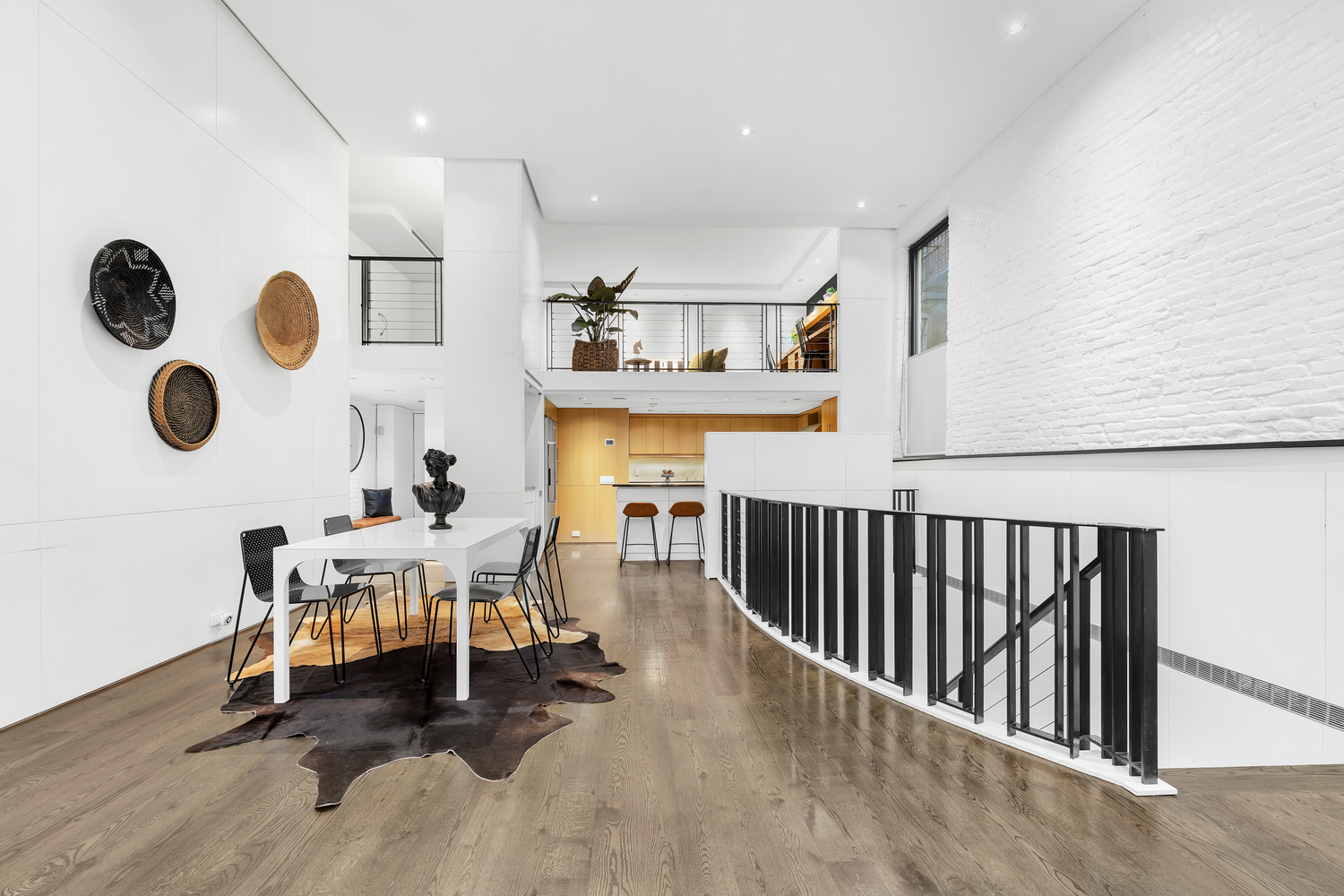 200 Mercer Street, Unit MAIS-G Manhattan, NY 10012 - Photo 3 of 17 a view of a dining room with furniture and chandelier
