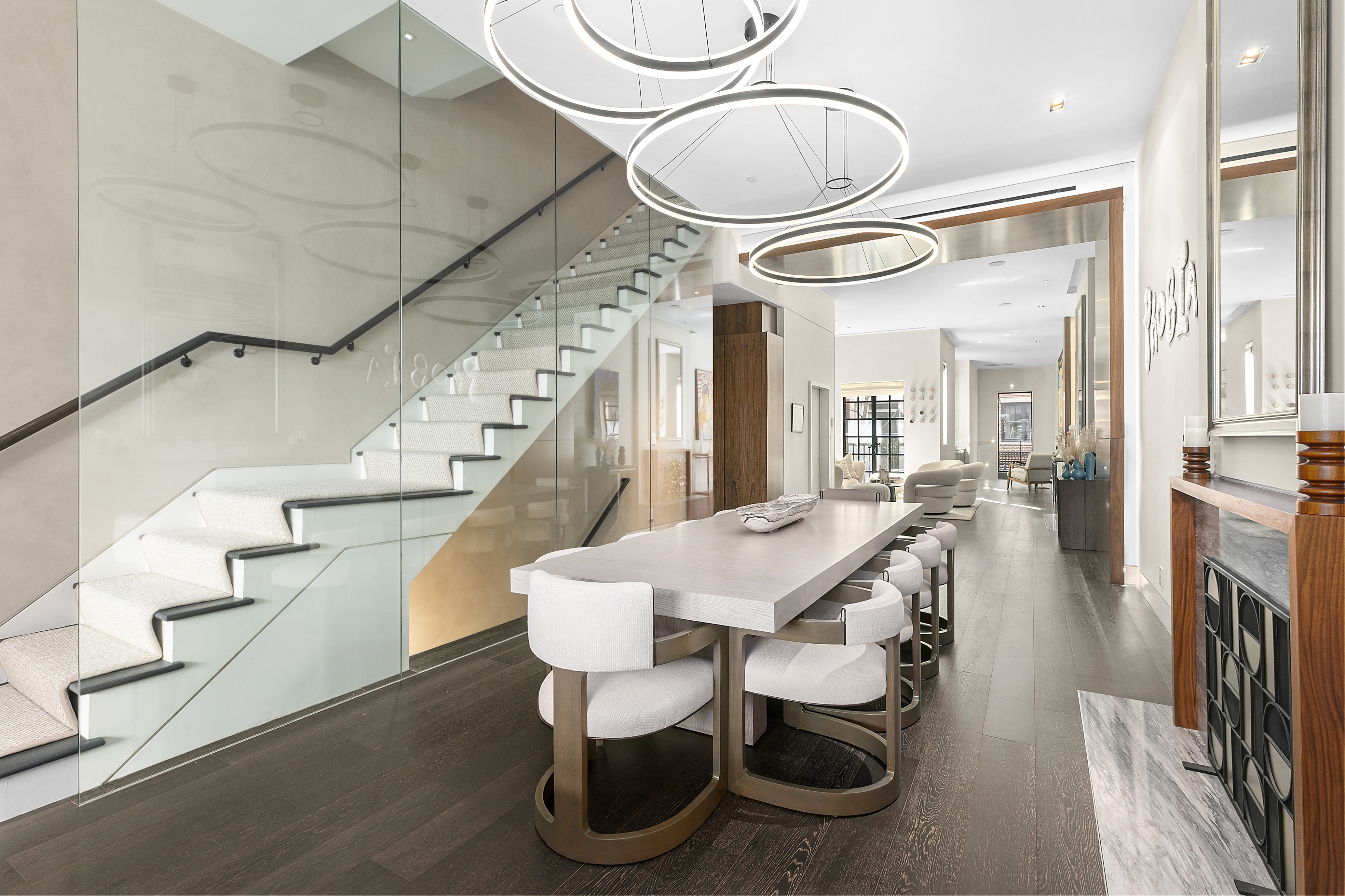 36 East 64th Street Manhattan, NY 10065 - Photo 3 of 27 a dining room with furniture and wooden floor