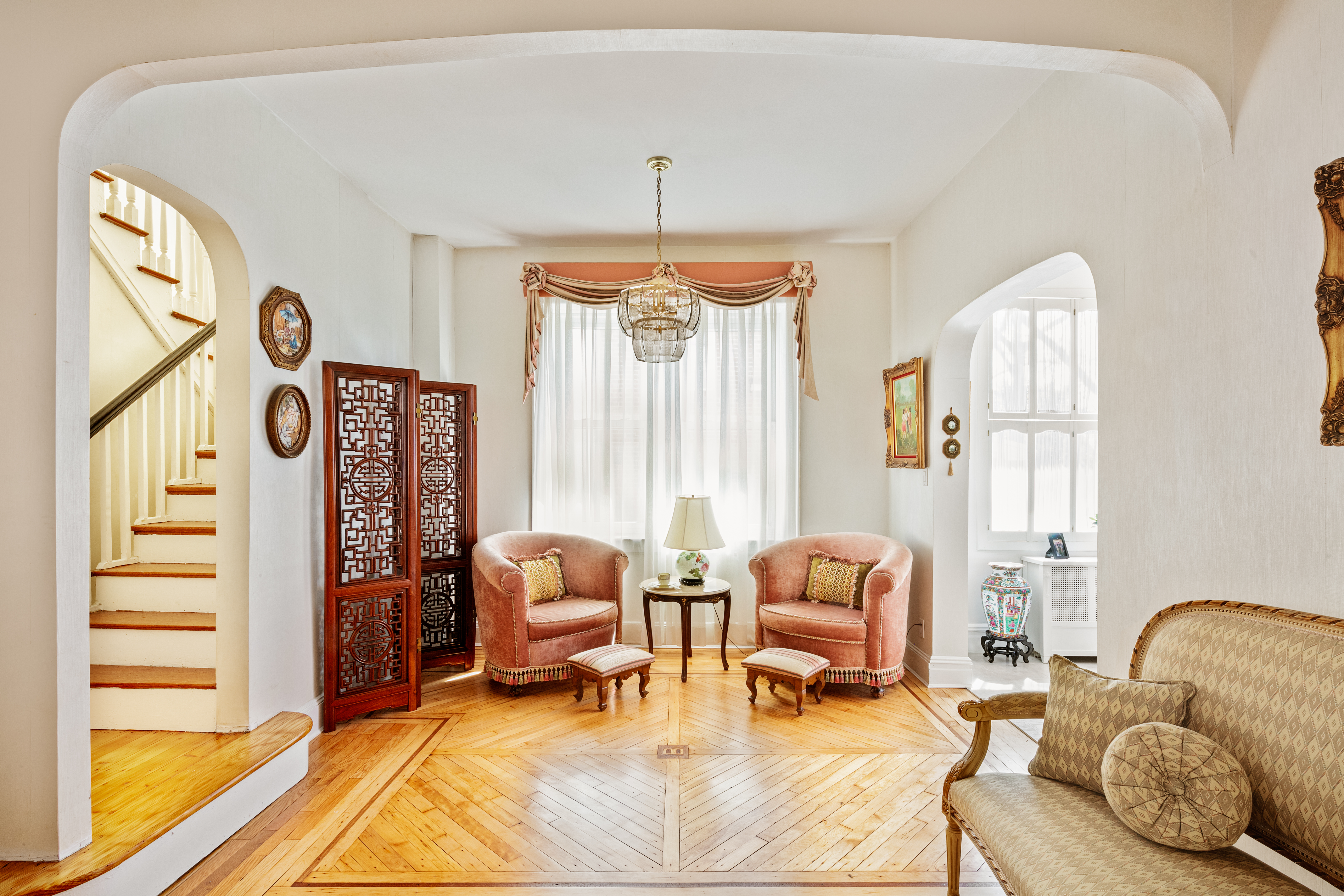 91 81st Street Brooklyn, NY 11209 - Photo 5 of 19 a living room with furniture and a chandelier