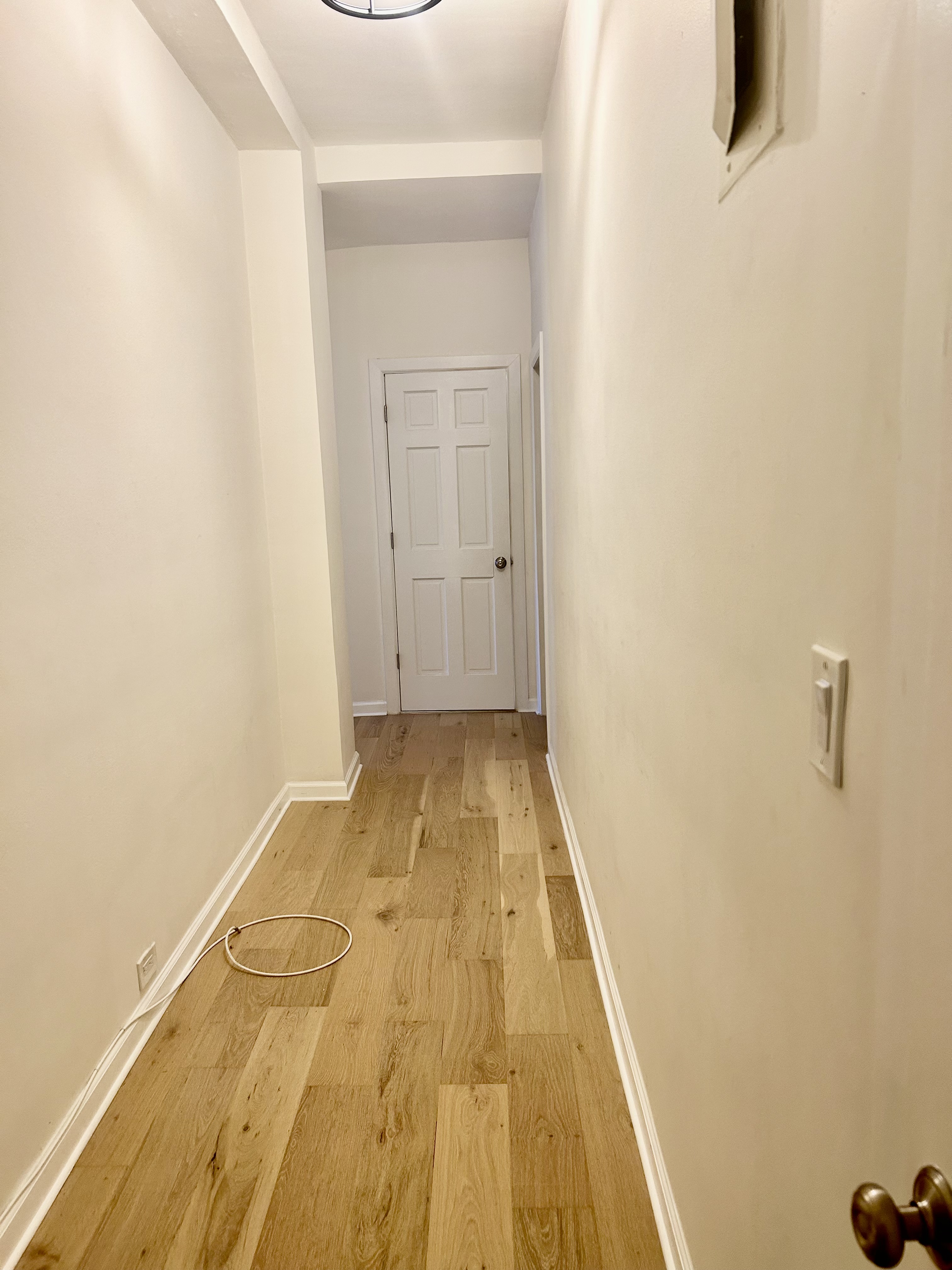 504 West 110th Street, Unit 3B Manhattan, NY 10025 - Photo 4 of 6 a view of a room with wooden floor and a potted plant