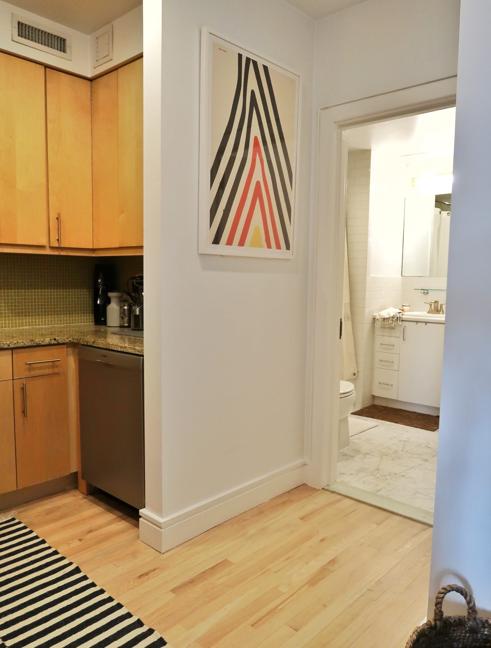 296 East 2nd Street, Unit 4G Manhattan, NY 10009 - Photo 8 of 14 a view of a kitchen with wooden floor and a sink