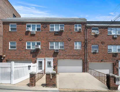 a front view of a house with a garage