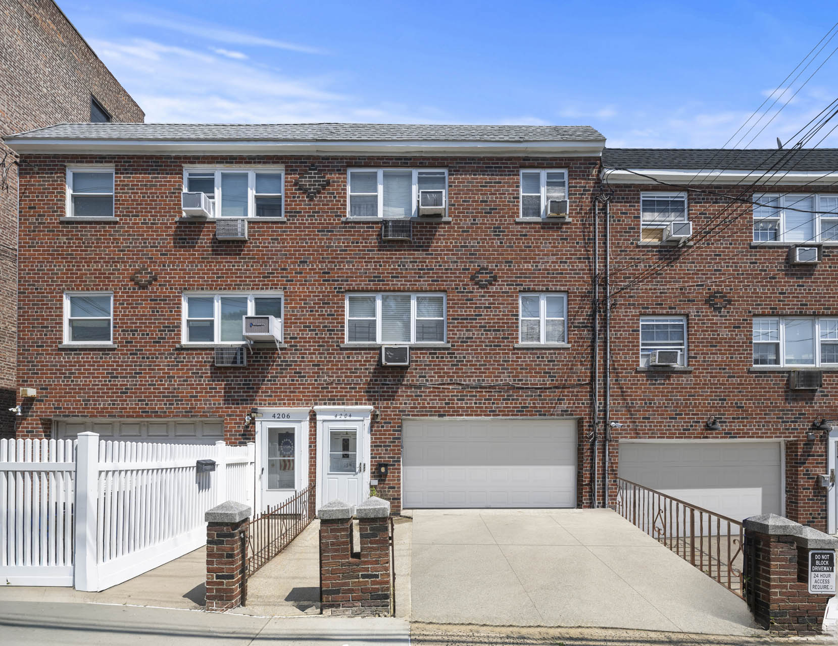 a front view of a house with a garage