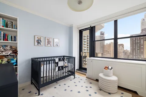 a bedroom with furniture and a window