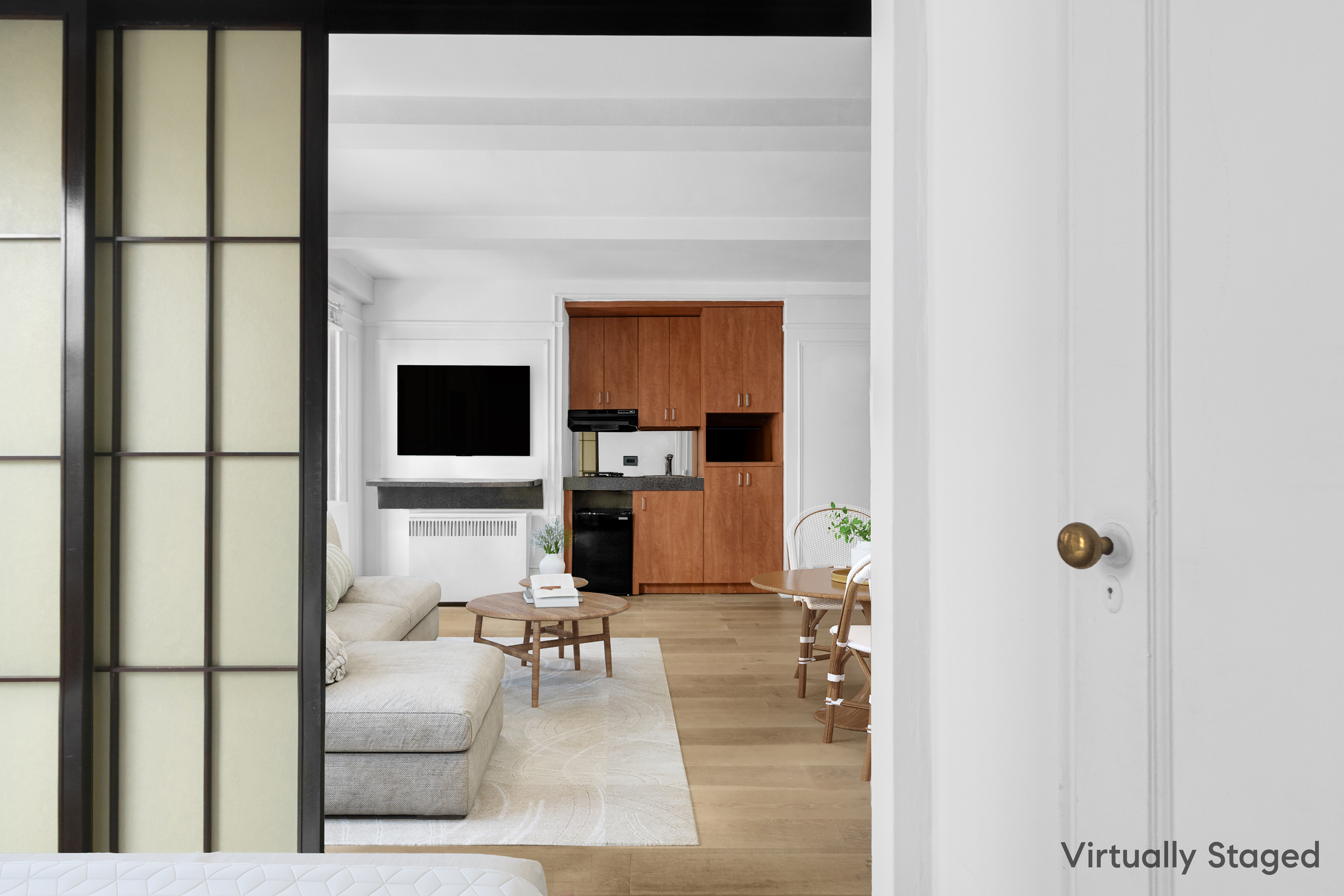 155 East 49th Street, Unit 3E Manhattan, NY 10017 - Photo 3 of 8 a living room with furniture and a flat screen tv