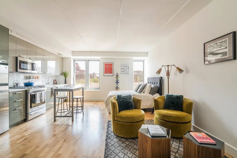 310 Clarkson Avenue, Unit 618 Brooklyn, NY 11226 - Photo 3 of 14 a living room with furniture and a wooden floor