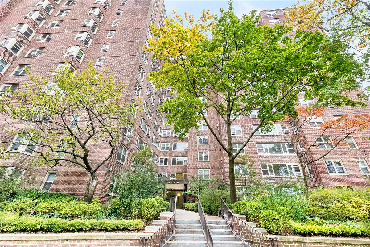 900 West 190th Street, Unit 10O Manhattan, NY 10040 - Photo 11 of 15 front view of a house with a tree