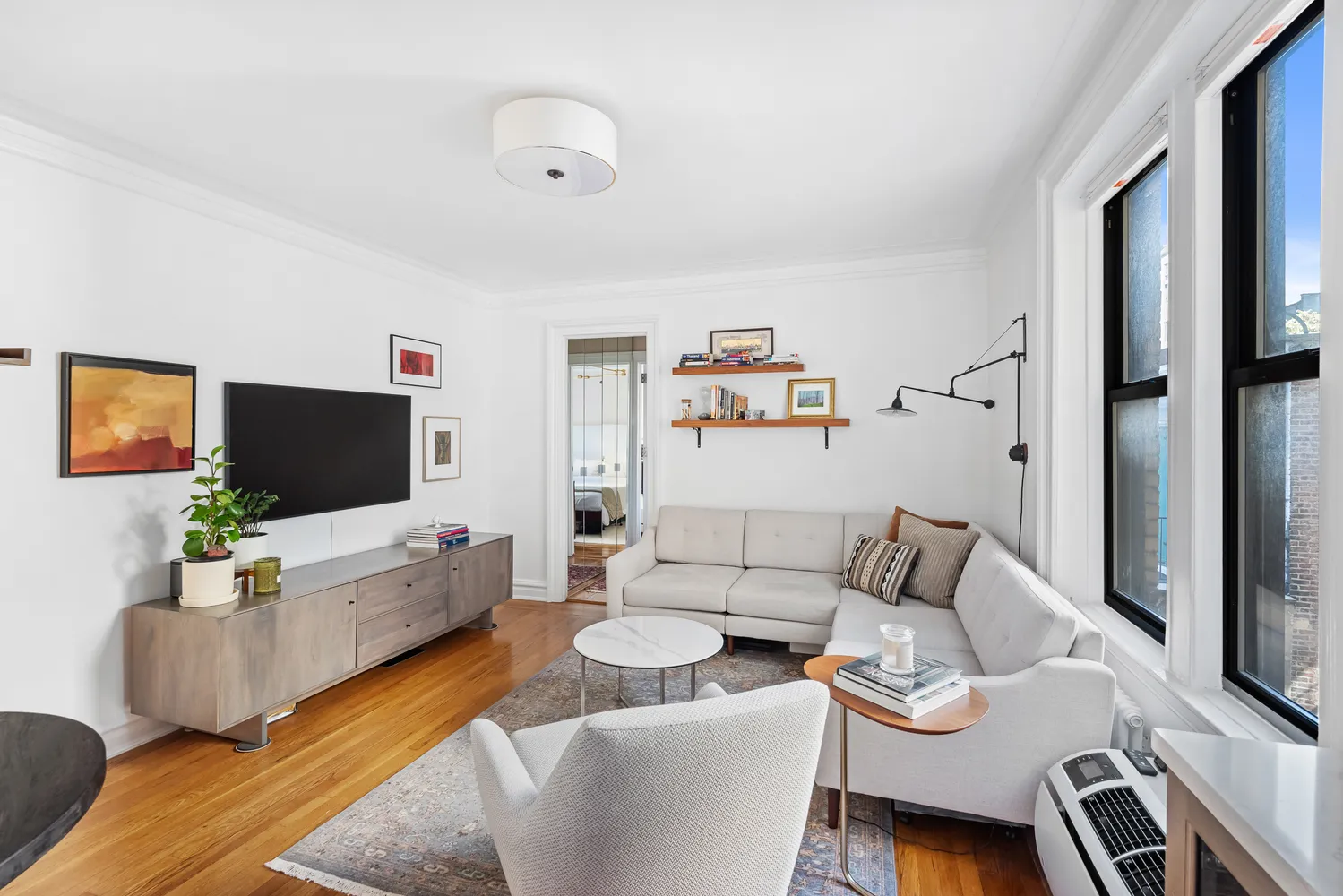 a living room with furniture and a flat screen tv