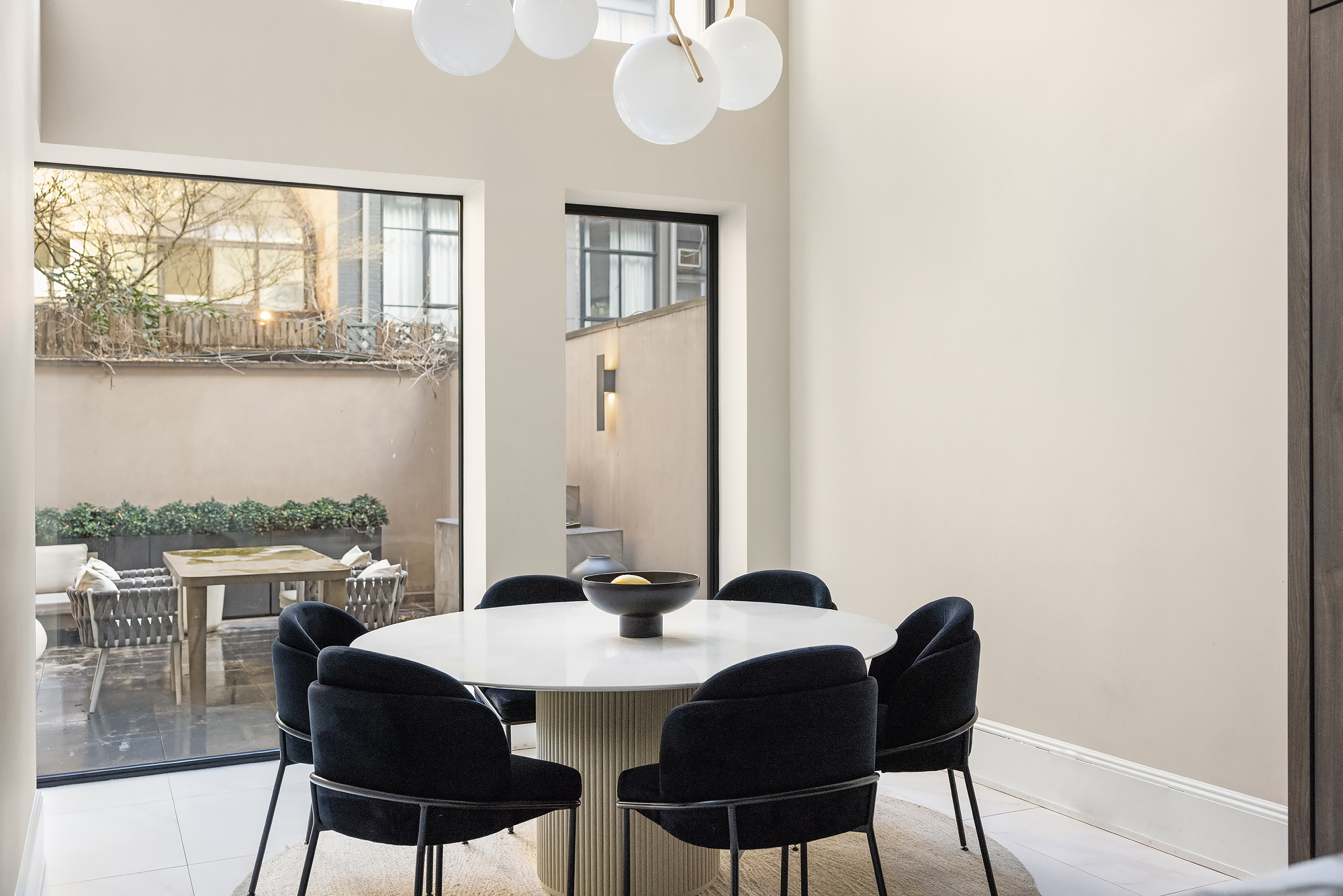 123 East 61st Street Manhattan, NY 10065 - Photo 25 of 31 a view of a dining room with furniture and window