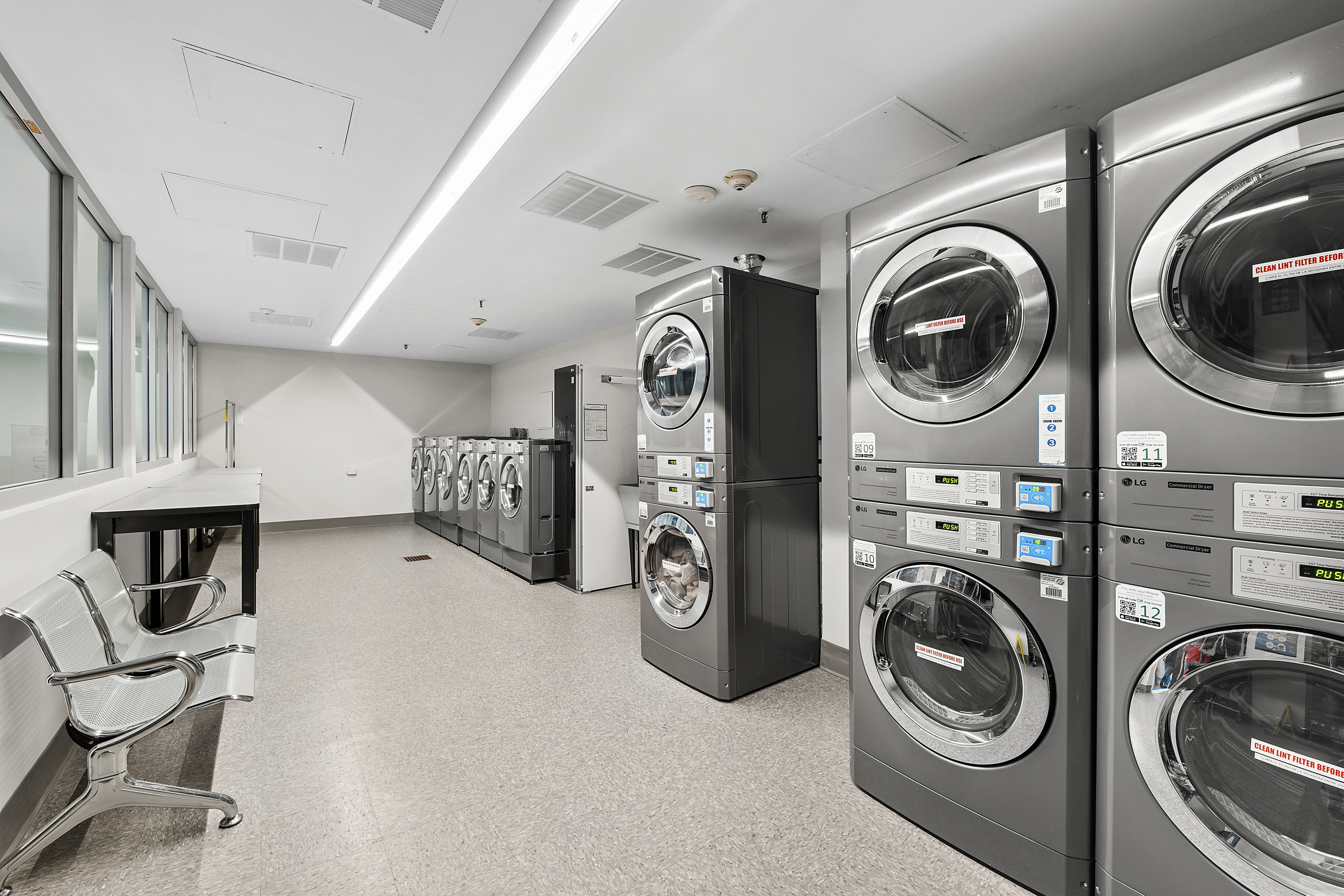 135 West 70th Street, Unit 8A Manhattan, NY 10023 - Photo 11 of 14 a view of storage and utility room with washer and dryer