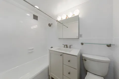 a bathroom with a sink a toilet and a bathtub