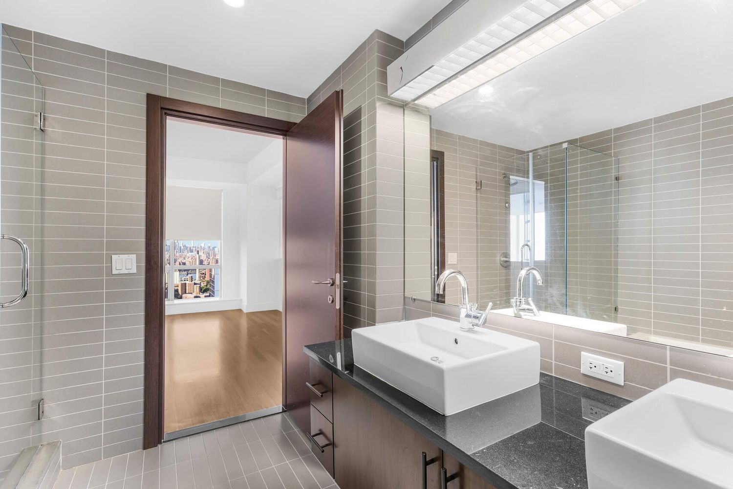 150 Myrtle Avenue, Unit PH3201 Brooklyn, NY 11201 - Photo 24 of 40 a bathroom with a sink and a mirror